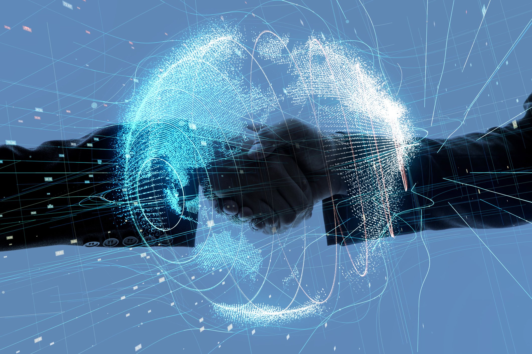 Two businessman shake hands with a digital globe in the foreground.