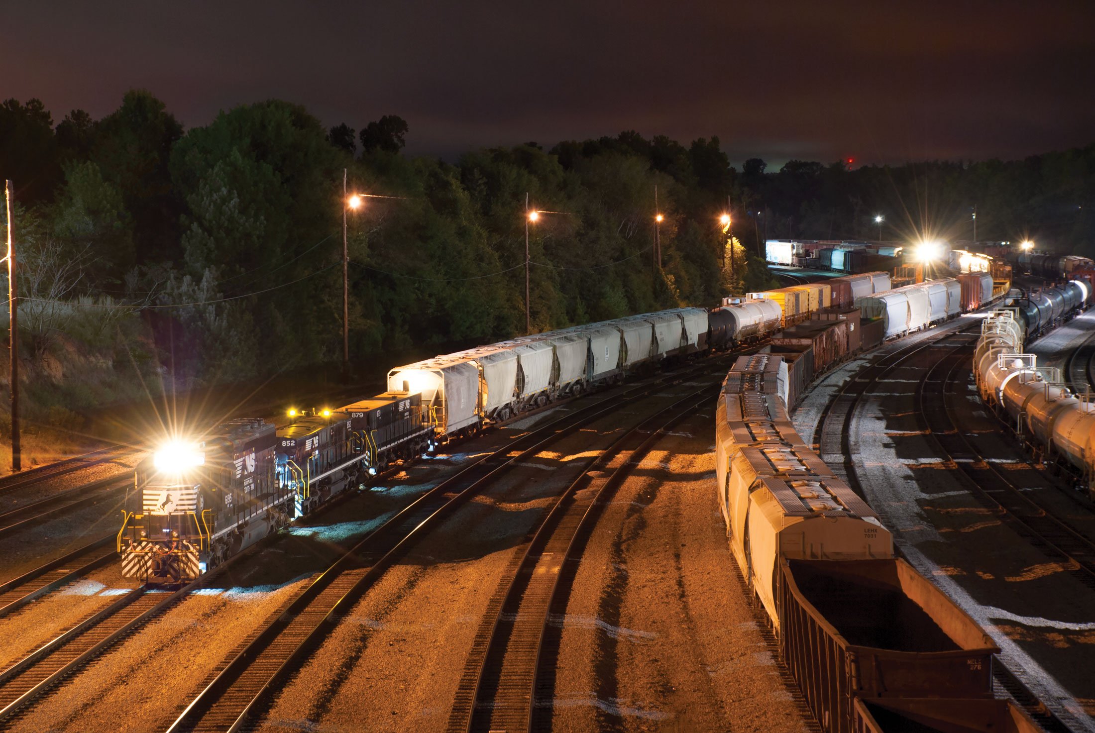 Rail yard at night.