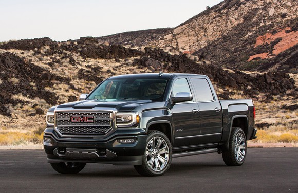 A black 2018 GMC Sierra Denali, an upscale crew-cab pickup truck. 