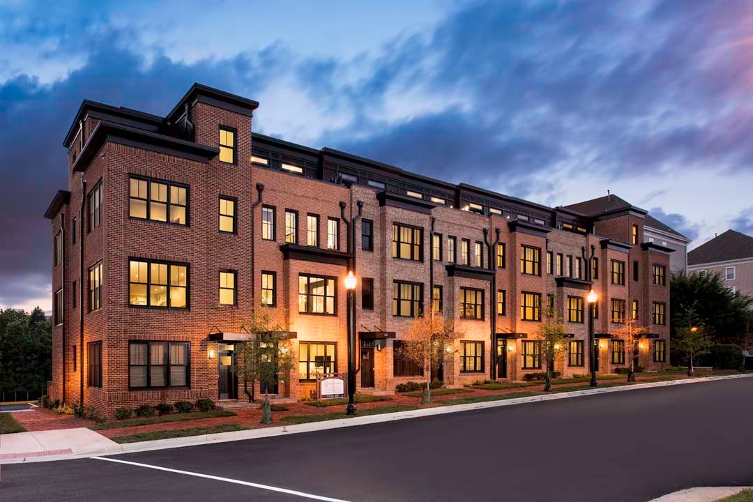 Townhome row at night.