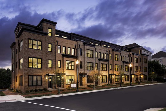 Townhome row at night.