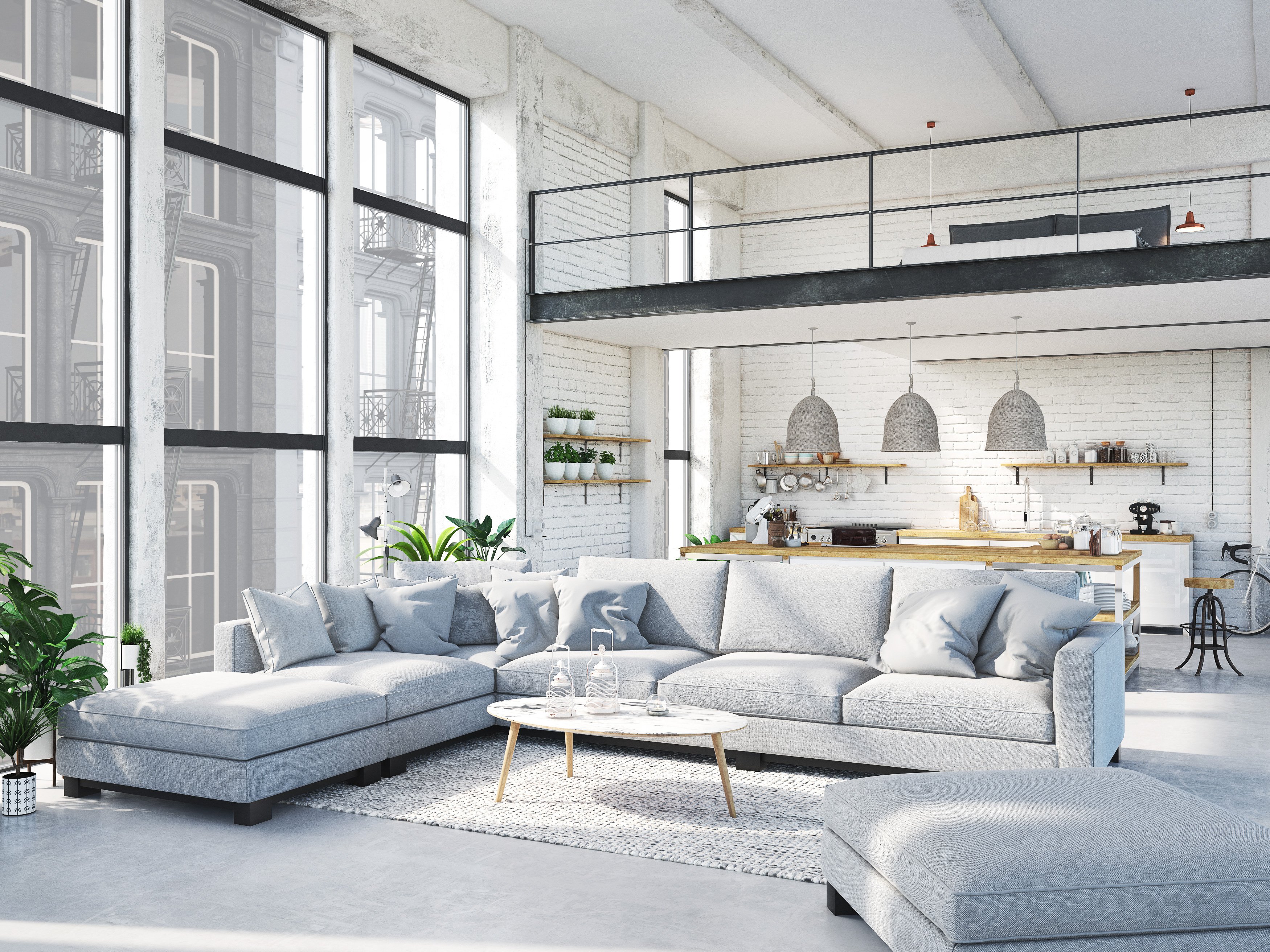 A large, brightly lit apartment with a seating arrangement of sofas.