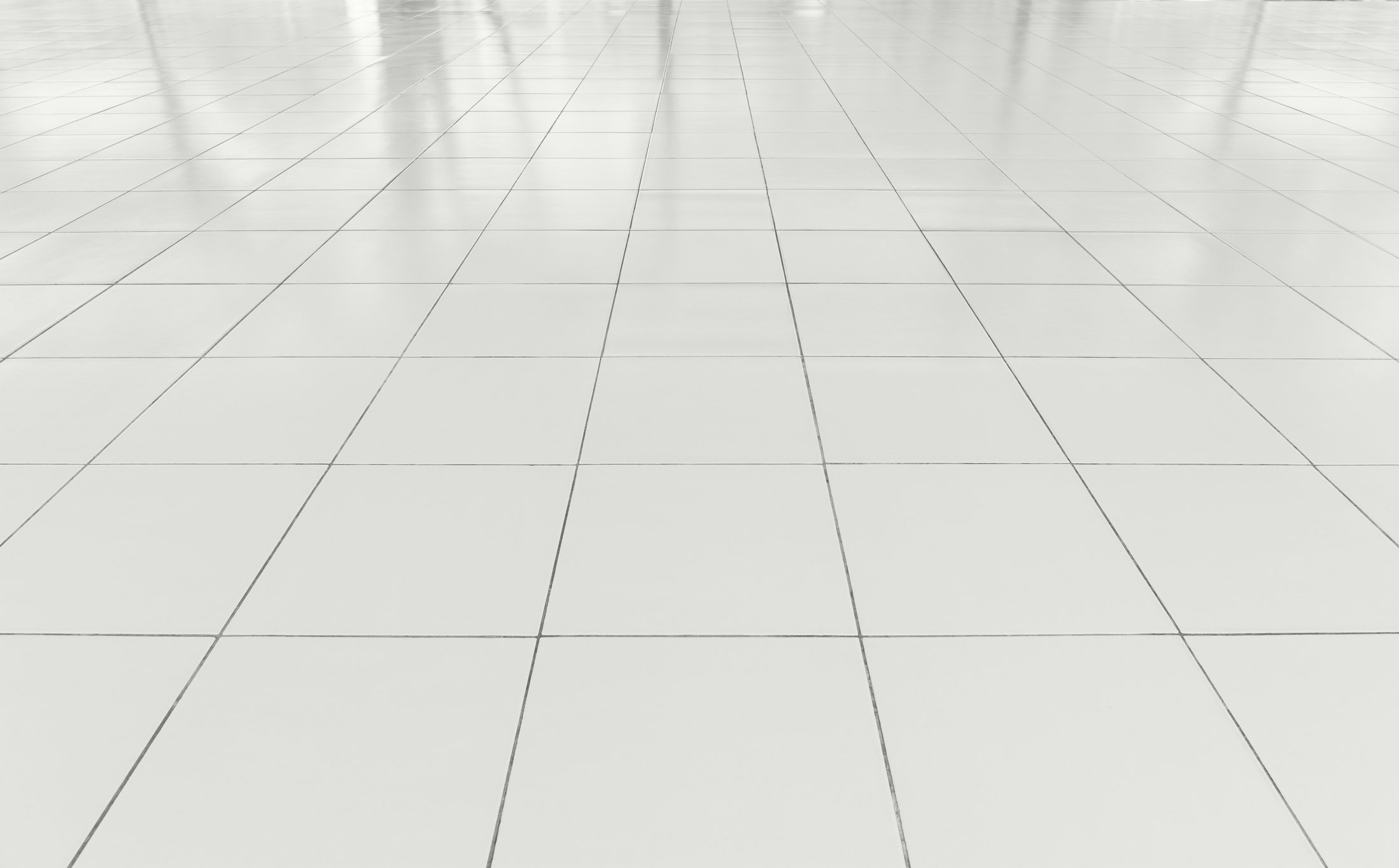 White floor made up of square tiles.