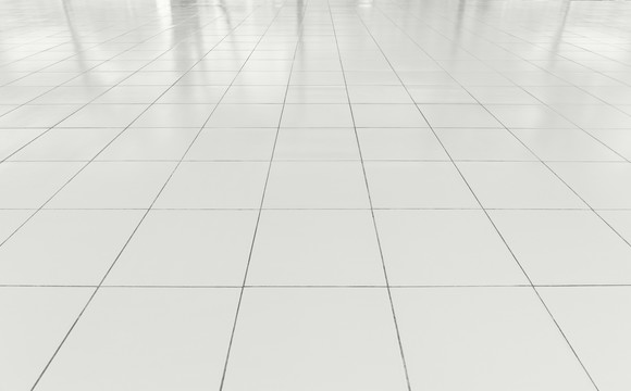 White floor made up of square tiles.