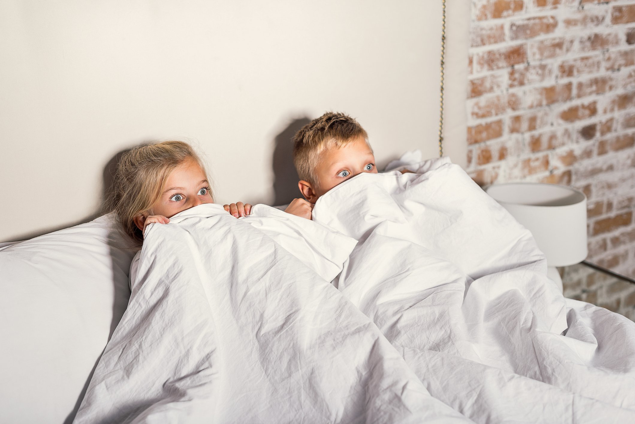 Kids hiding under covers