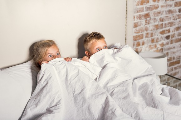 Kids hiding under covers