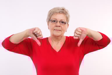 senior woman thumbs down GettyImages-518408758