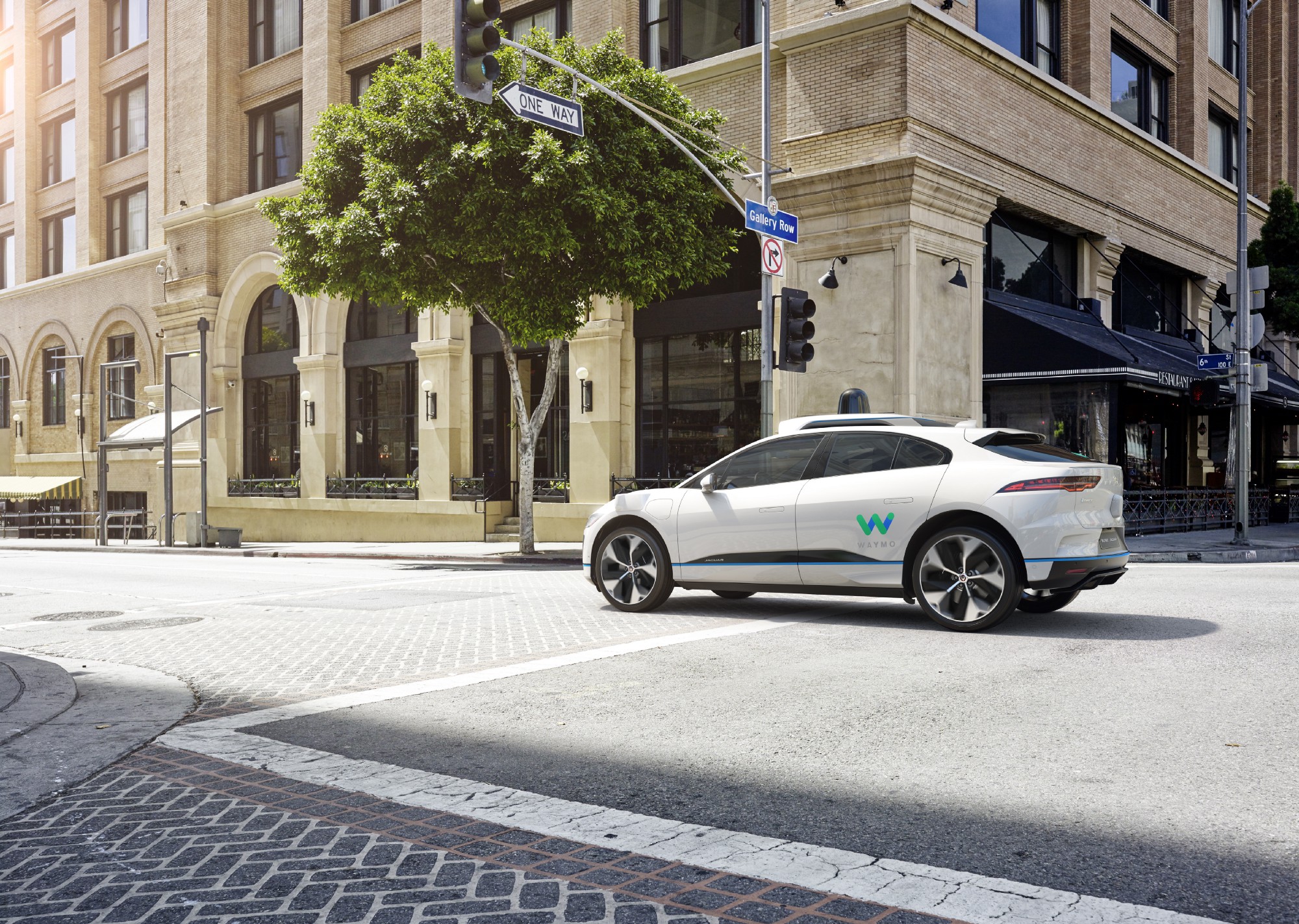 Waymo Jaguar iPace crossing intersection