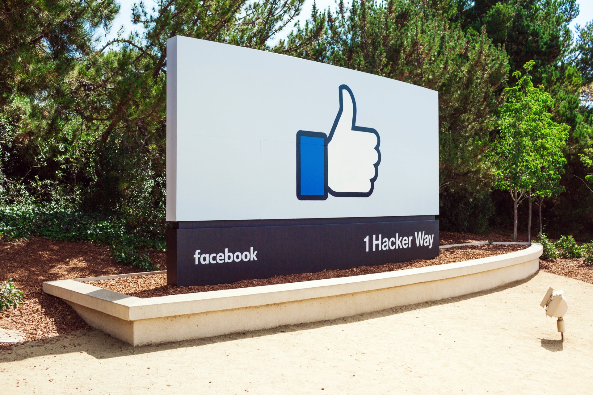 The address sign with a thumbs-up icon outside the main entrance to Facebook HQ.