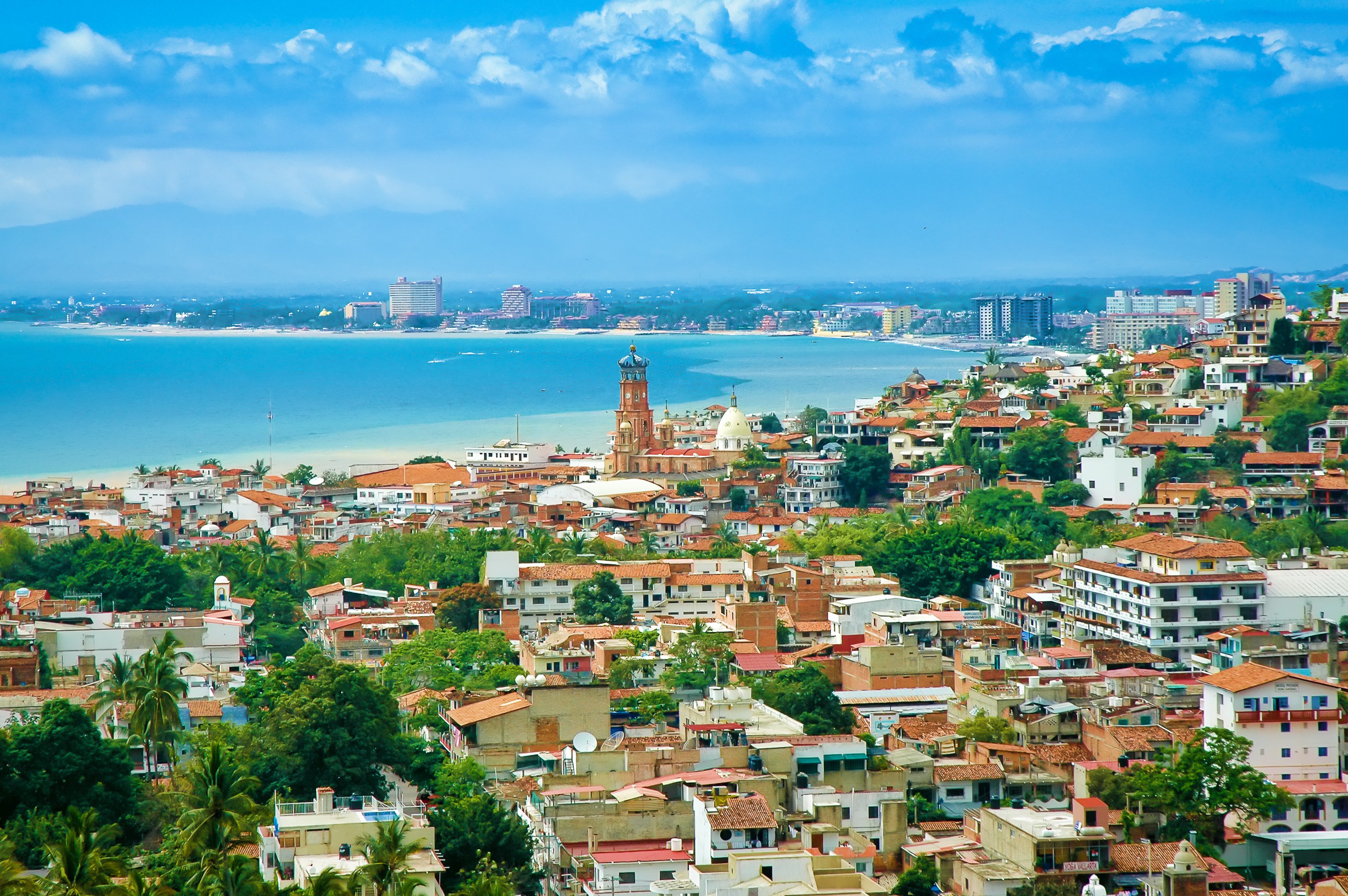 View of bay from high vantage point, sweeping over colorful homes.