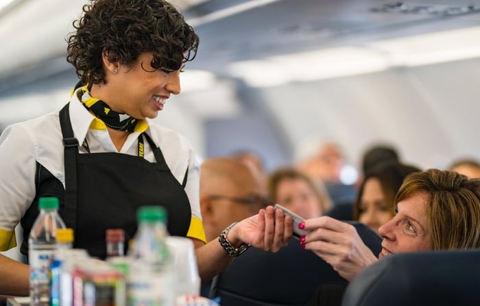 Spirit Airlines stewardess serving passenger