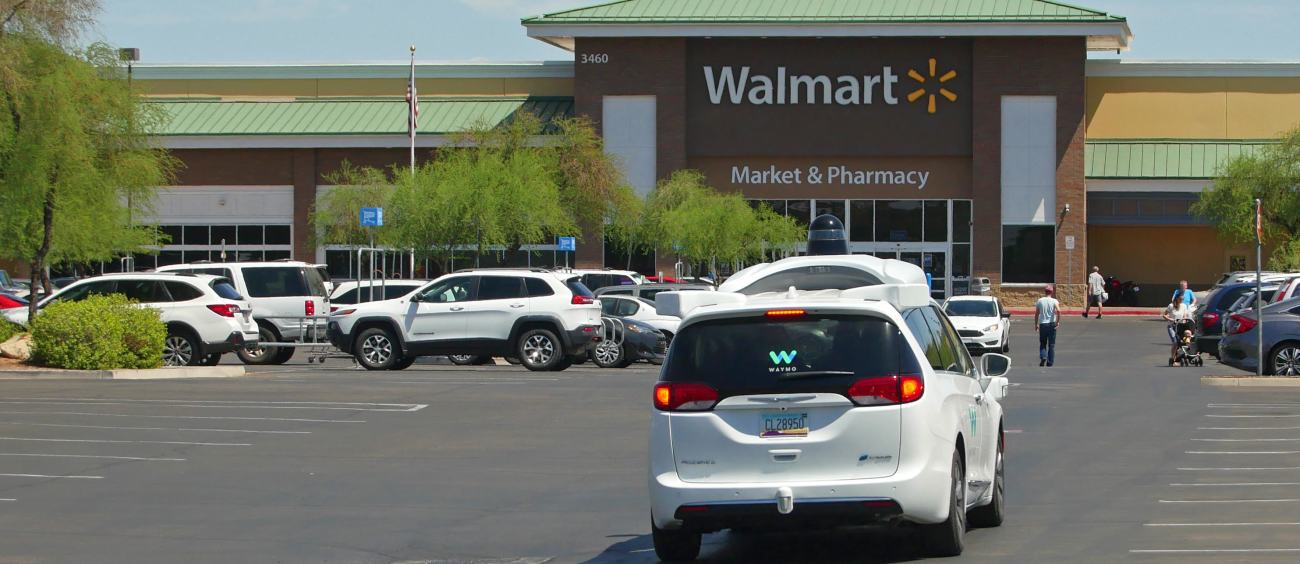 A Waymo car in a Walmart parking lot