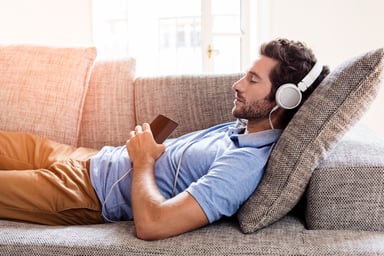 man listening to music on phone