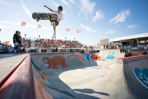 Vans-sponsored skater CJ Collins airborne in the middle of a trick.