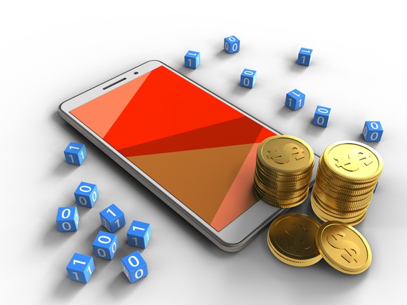 A mobile phone surrounded by coins and dice.