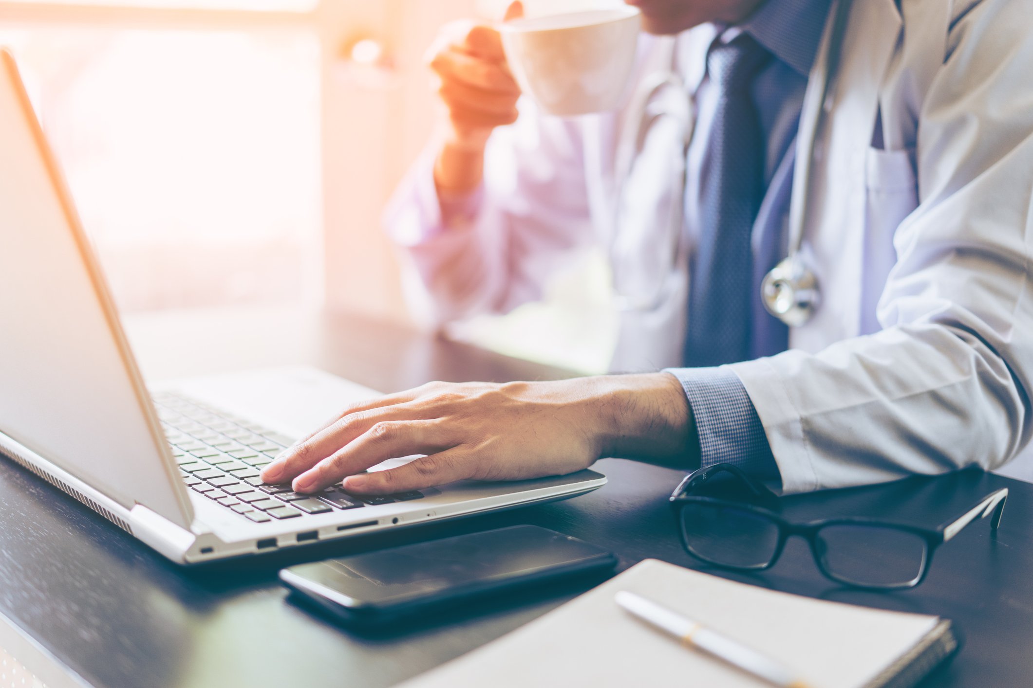 Doctor using laptop