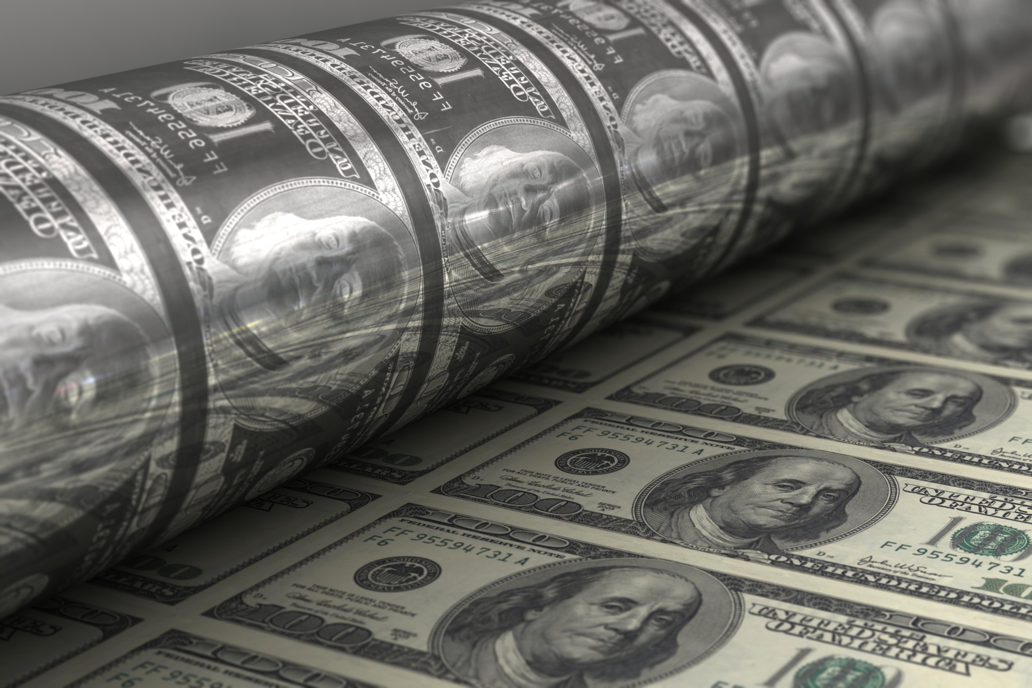 A press at the U.S. mint printing hundred dollar bills. 