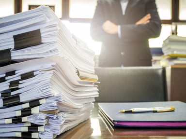 pile of paperwork on a desk_GettyImages-684309324