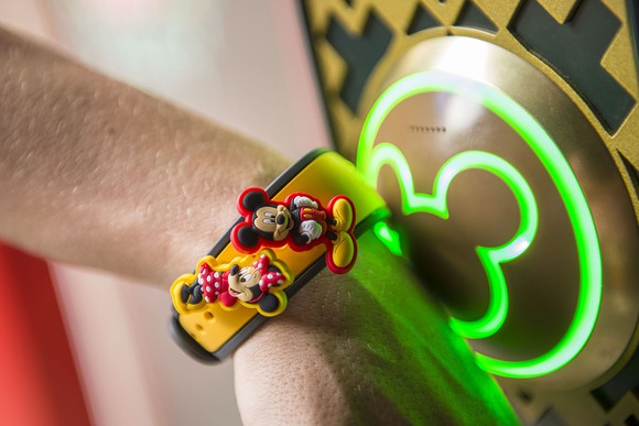 A Disneyland visitor uses a MagicBand.