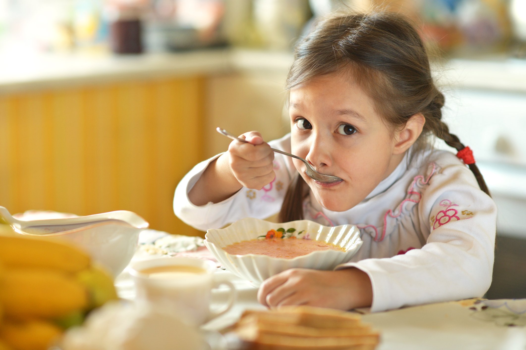 Girl eating soup