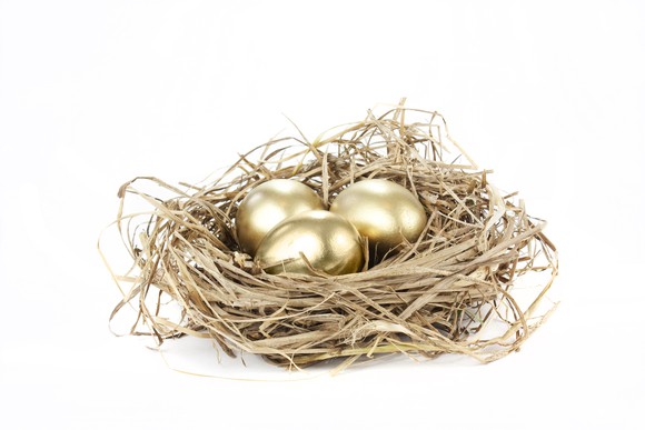 Three golden eggs in a nest.