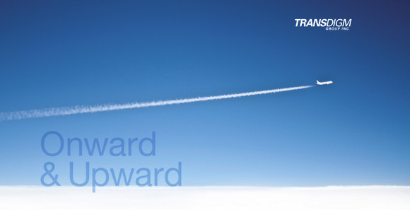 Jet with contrail flying across sky, with TransDigm logo and slogan