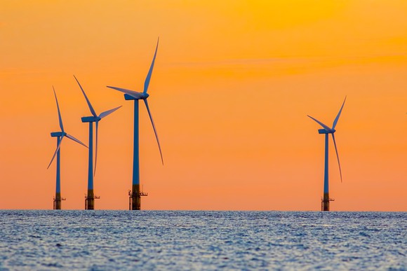 Offshore wind turbines at dawn.