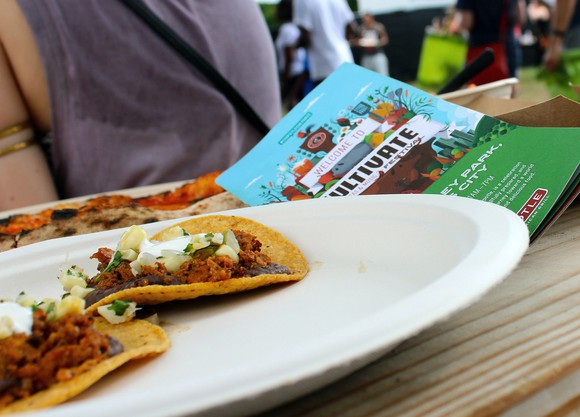 Plate with tostadas on a table next to a Chipotle flyer.