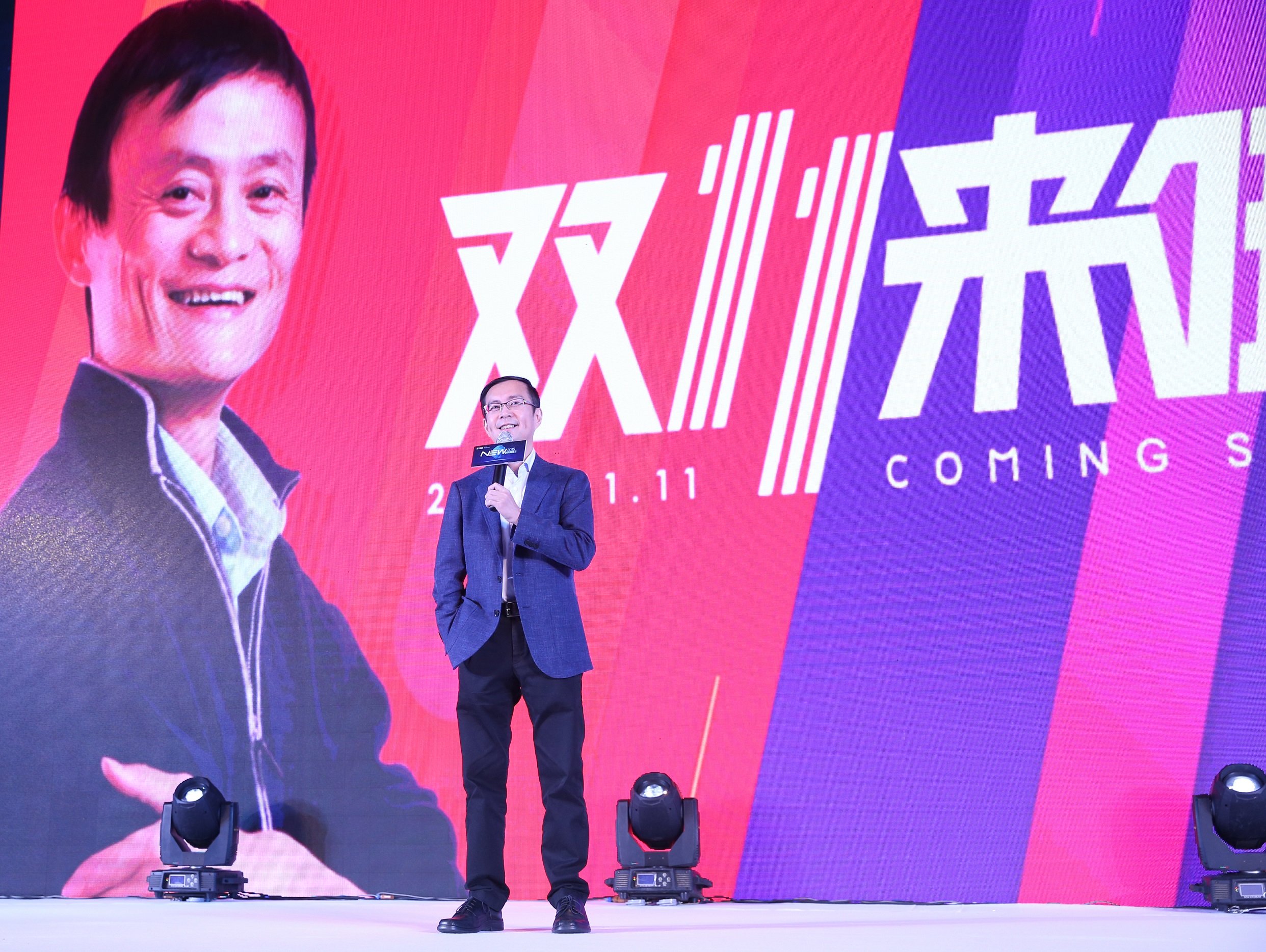 Alibaba CEO Jack Ma in the backdrop at a media presentation.