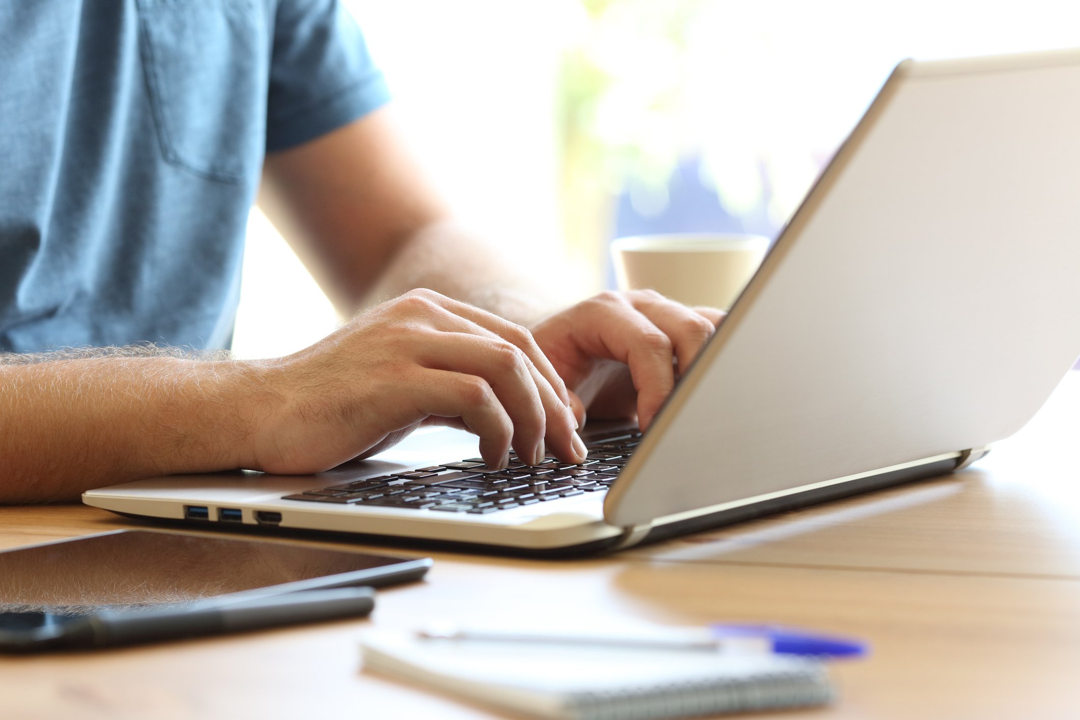 Man typing on laptop