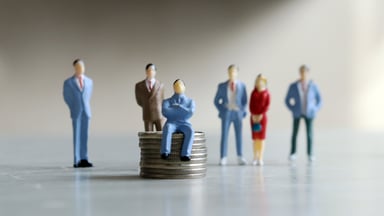 stack of coins small people getty