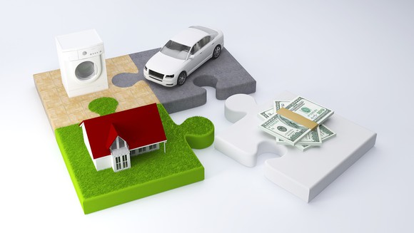 Puzzle pieces holding drier, car, and house separated from money.