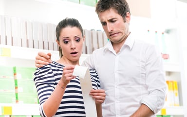 Young Couple Horrified By Long Receipt Getty