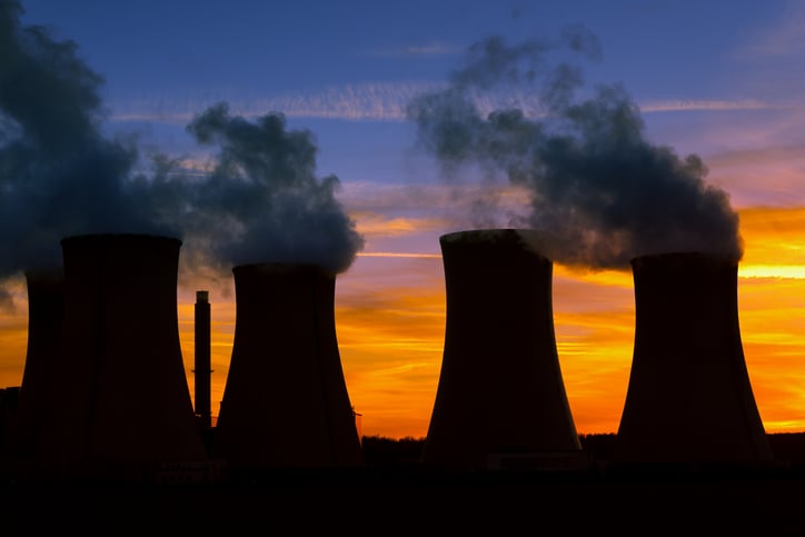 Cooling towers in silhouette. 