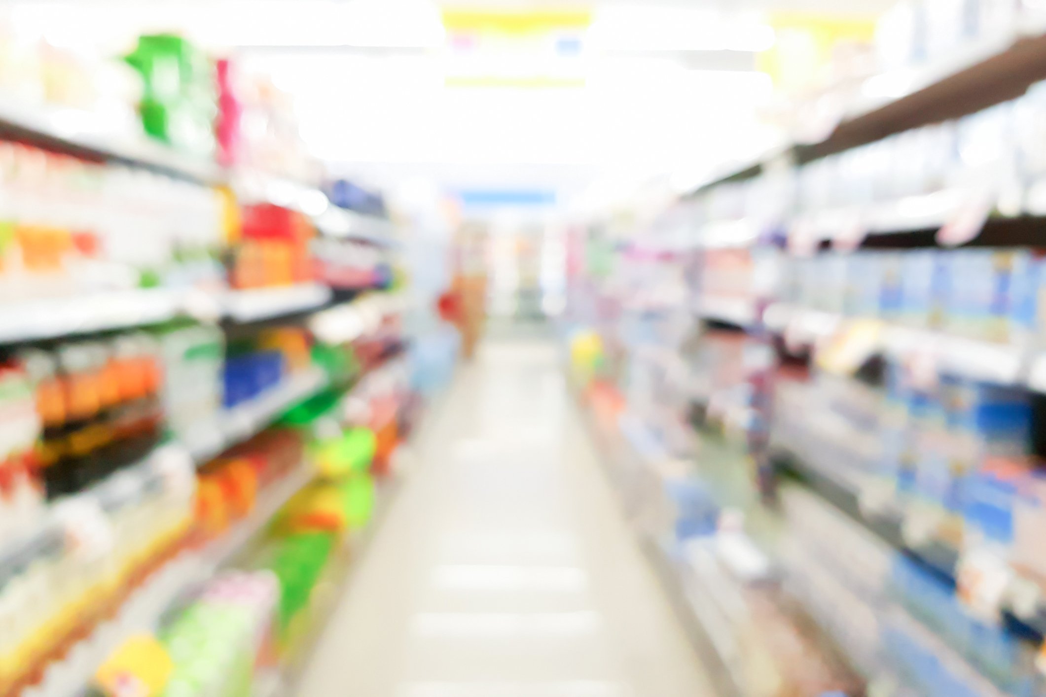 A blurry image of a supermarket aisle