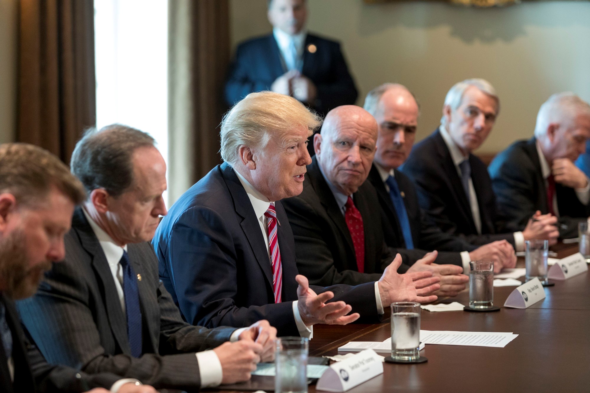 President Trump in meeting with his advisors.