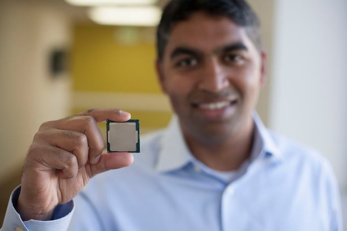 Intel executive Anand Srivatsa holding a desktop processor.