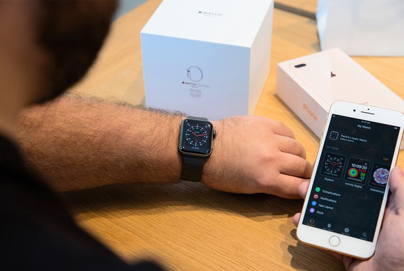 Person setting up and pairing an Apple Watch 