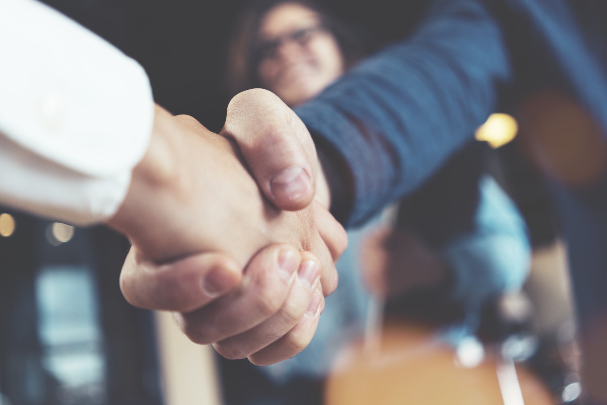 Two people shaking hands.