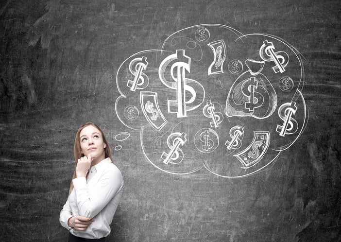Woman with thoughtful expression in front of a chalkboard thought balloon containing dollar signs