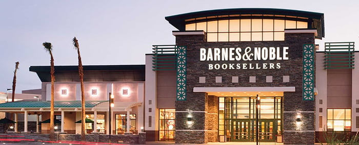 Barnes & Noble location with palm trees on a clear and foggy day.