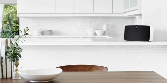 Sonos wireless speaker in a mostly white kitchen.