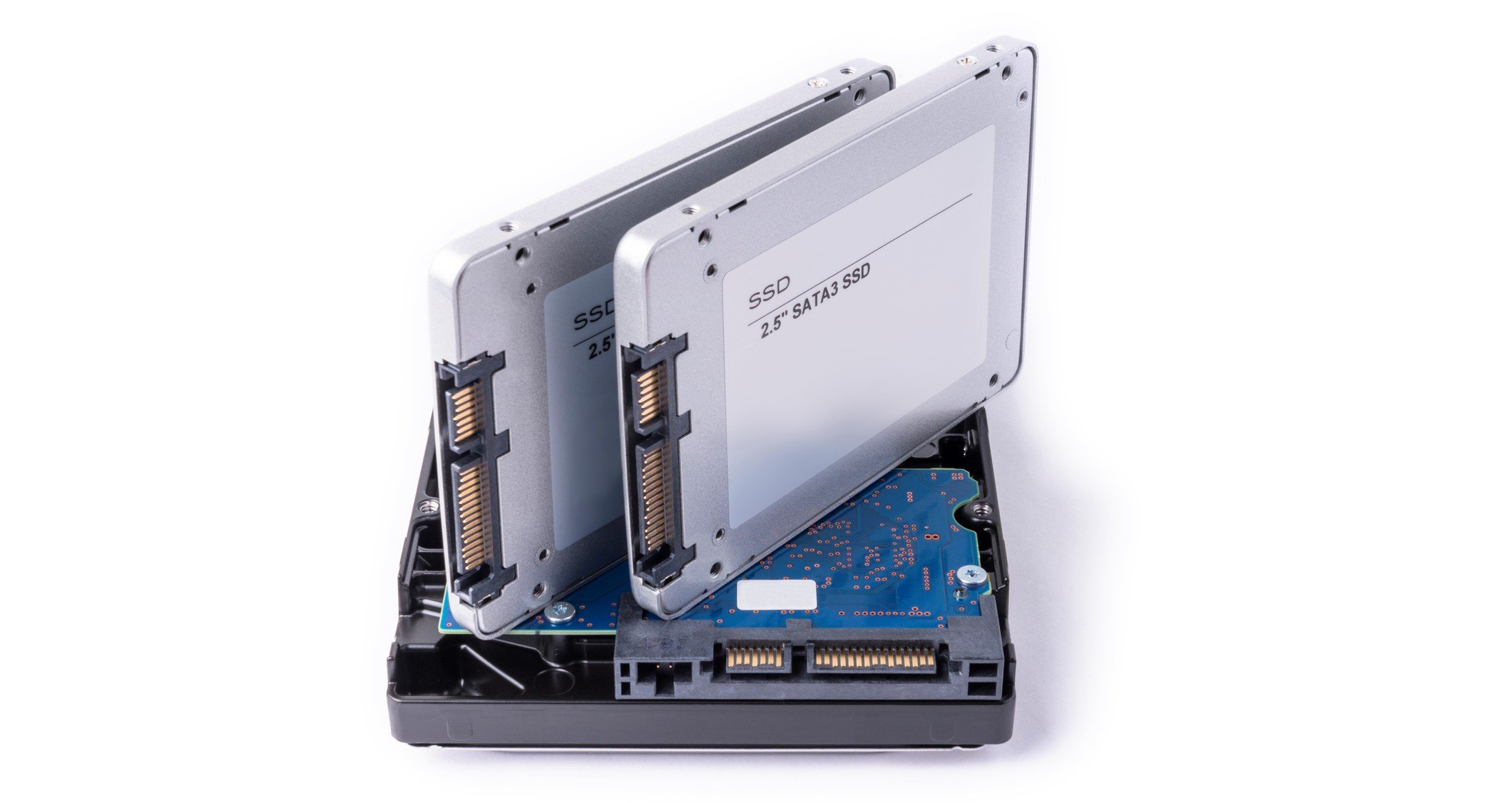 Two SSDs placed on top of a traditional HDD.
