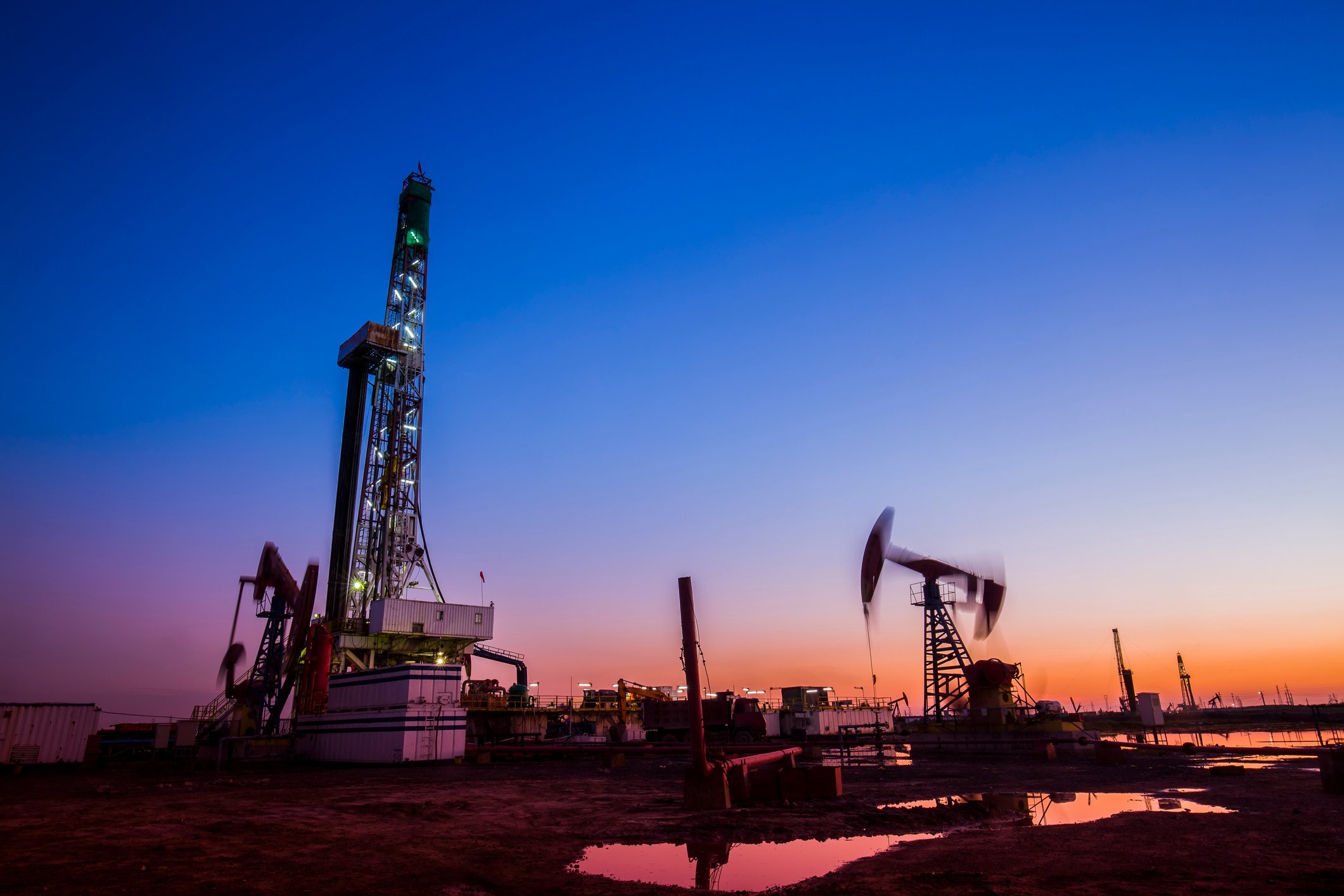 A drilling rig at dusk.