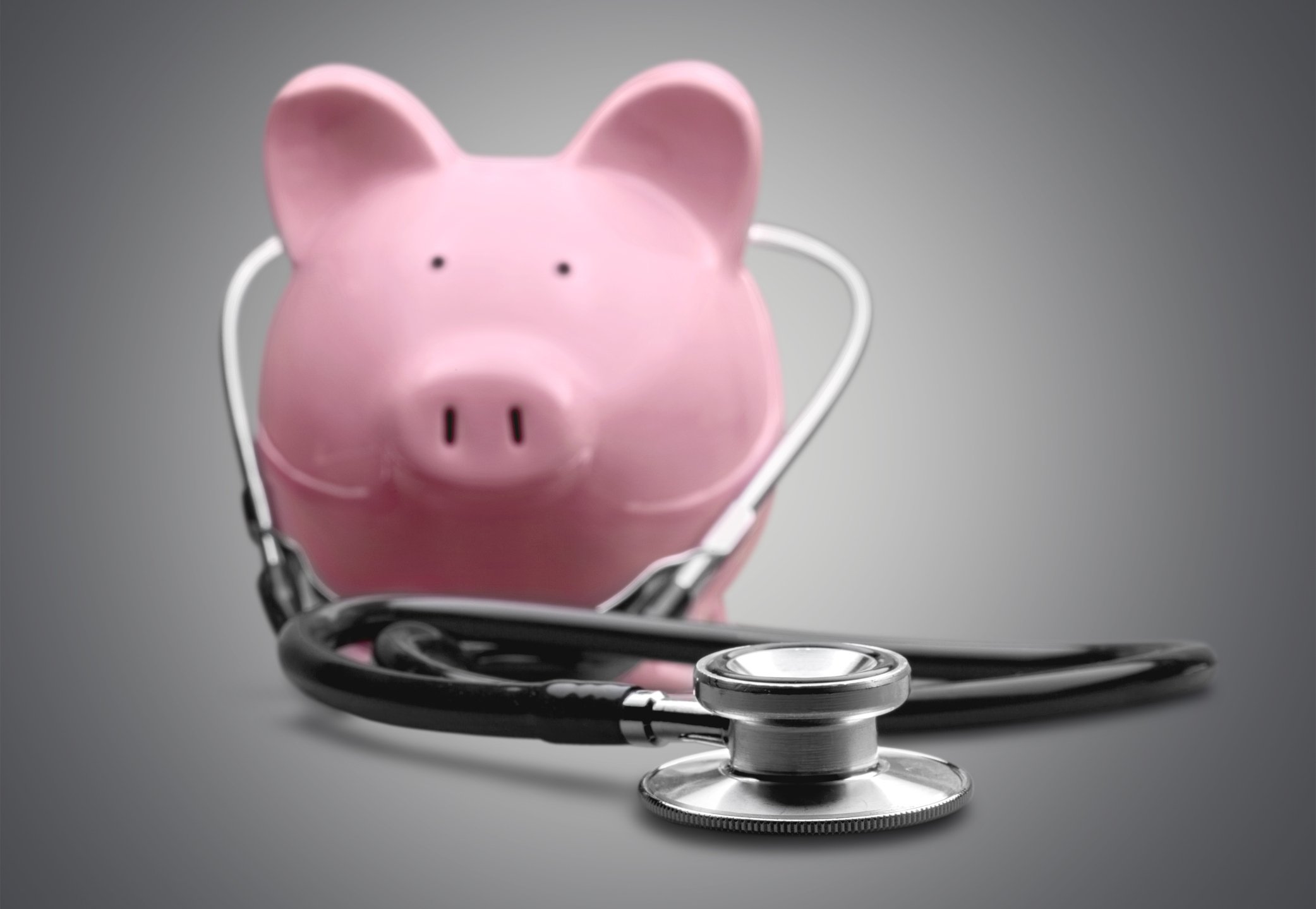 Piggybank wearing a stethoscope