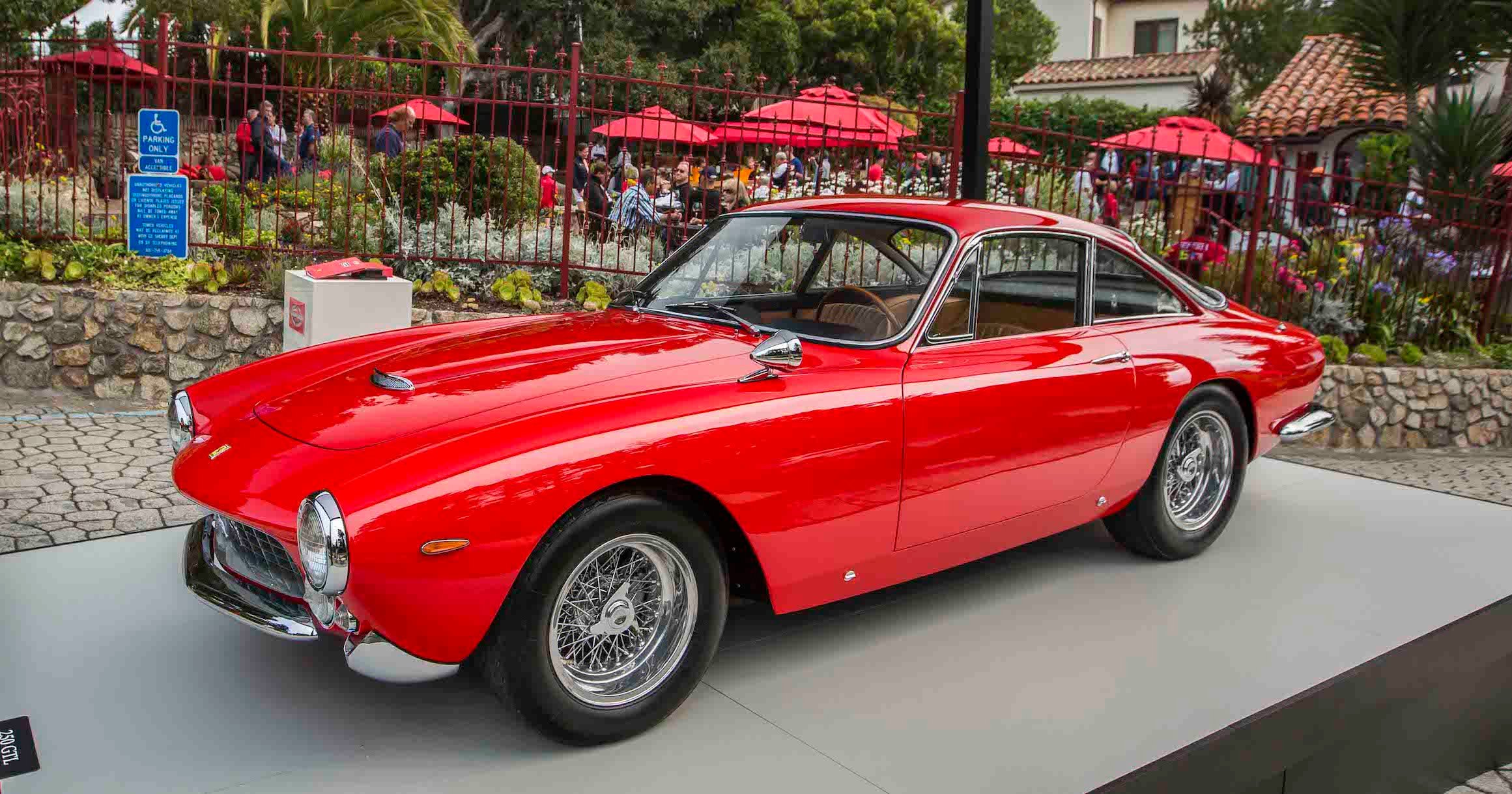A red Ferrari 250 GT Lusso, a front-engined two-seat model made in 1963 and 1964.