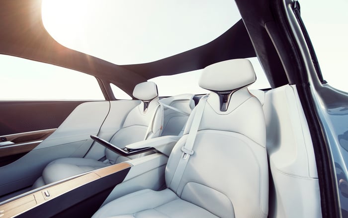 A view of the rear seat of the Lucid Air, with two plush reclining seats trimmed in white leather.