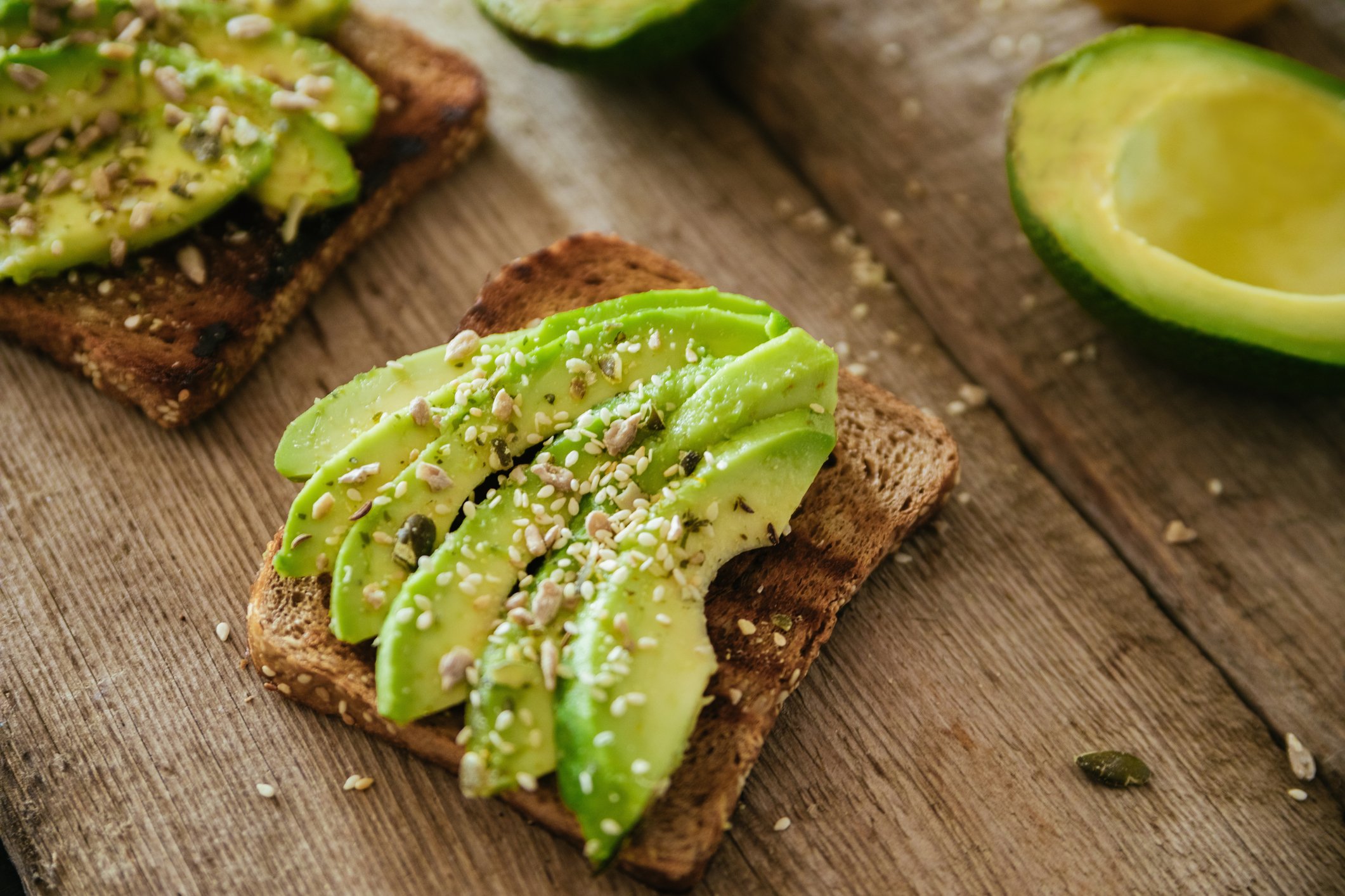 Avocado toast on a wooden table.