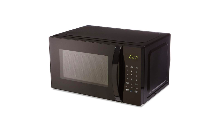 A black AmazonBasics microwave.
