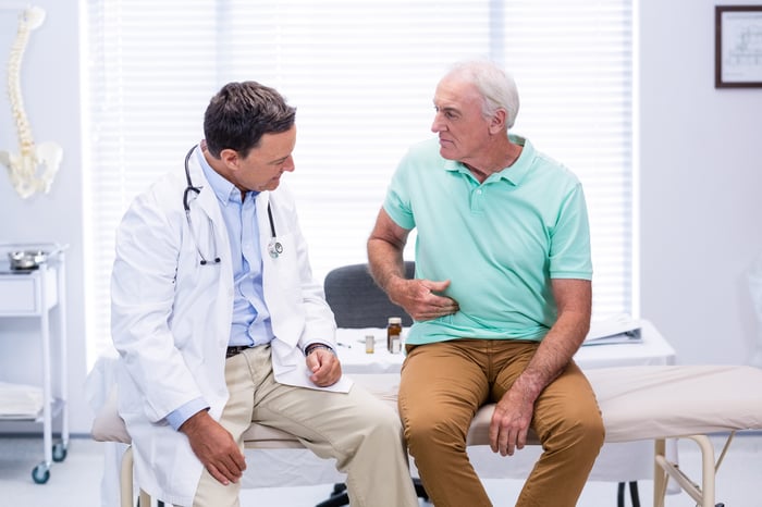 Senior male talking to doctor